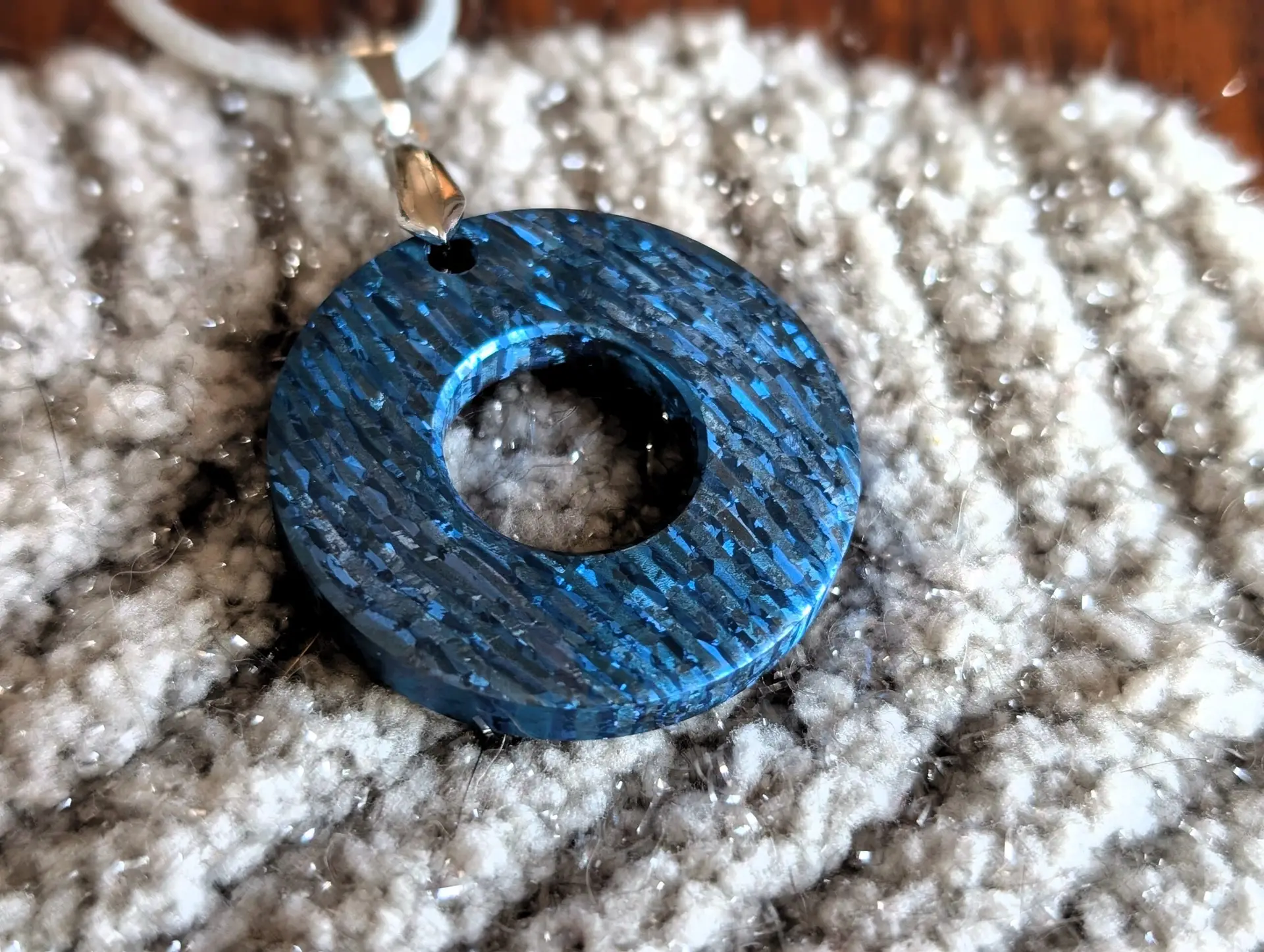 Crystal blue titanium damascus pendant